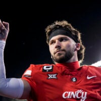 Oct 25, 2025; Cincinnati, Ohio, USA; Cincinnati Bearcats quarterback Brendan Sorsby points to fans as he walks off the field after defeating the Baylor Bears at Nippert Stadium.