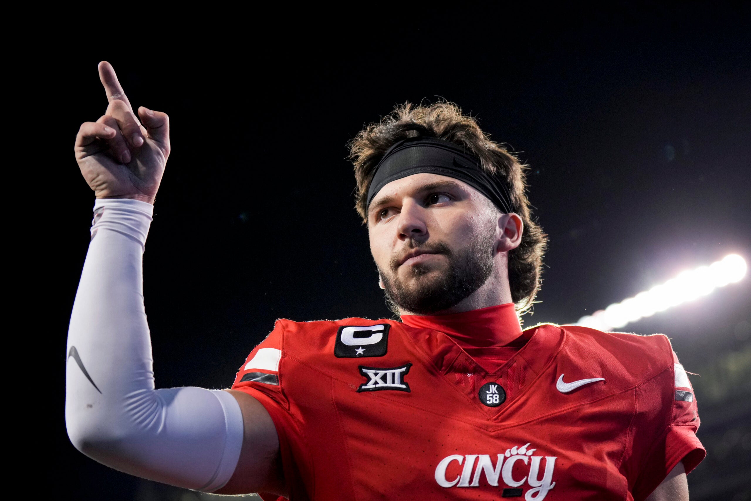 Oct 25, 2025; Cincinnati, Ohio, USA; Cincinnati Bearcats quarterback Brendan Sorsby points to fans as he walks off the field after defeating the Baylor Bears at Nippert Stadium.
