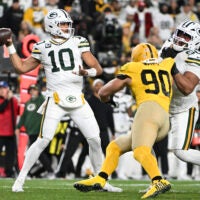 Oct 26, 2025; Pittsburgh, Pennsylvania, USA; Green Bay Packers quarterback Jordan Love (10) passes against Pittsburgh Steelers linebacker T.J. Watt (90) during the second quarter at Acrisure Stadium.
