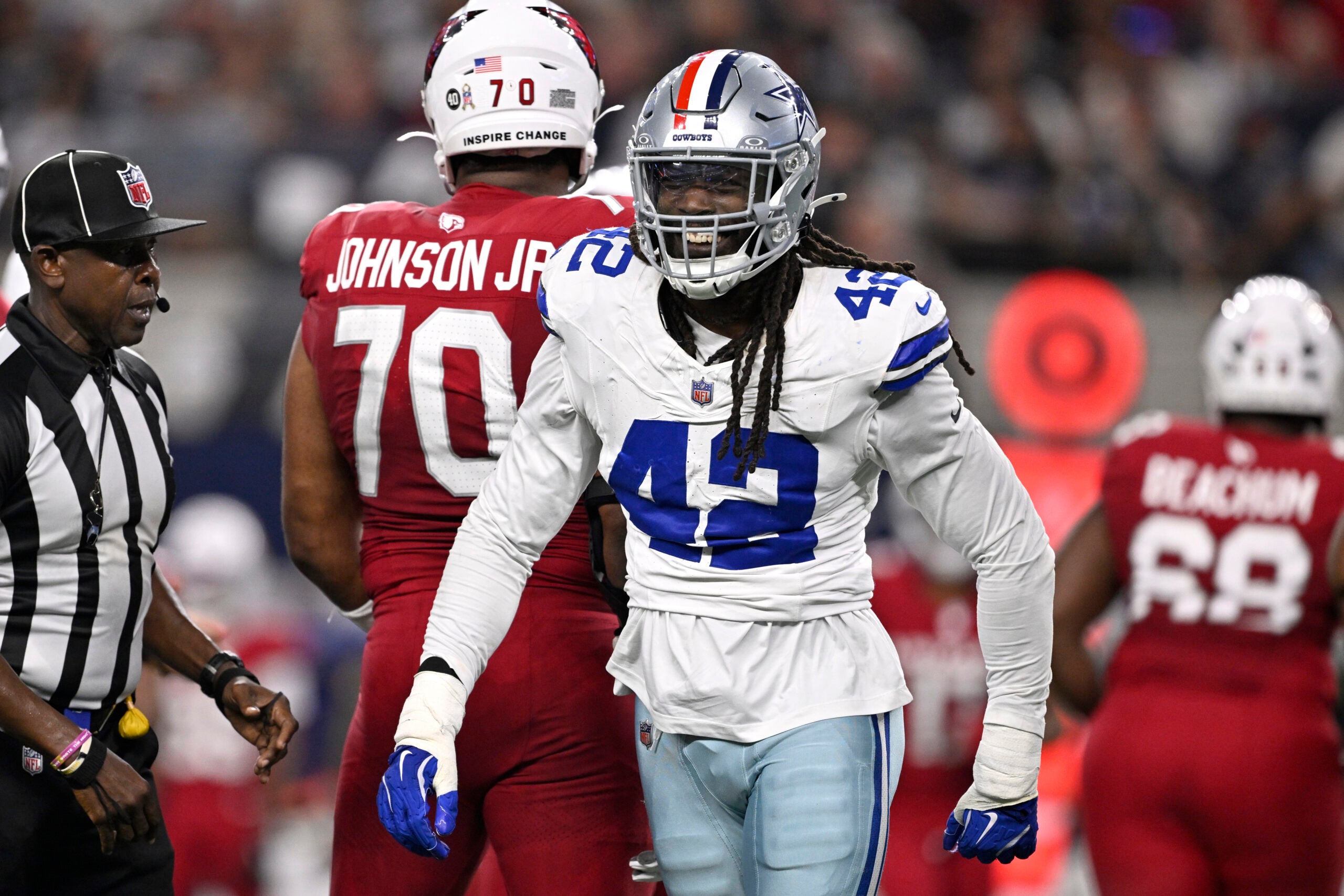 Nov 3, 2025; Arlington, Texas, USA; Dallas Cowboys defensive end Jadeveon Clowney (42) reacts after a sack against Arizona Cardinals quarterback Jacoby Brissett (7) in the first half at AT&T Stadium.