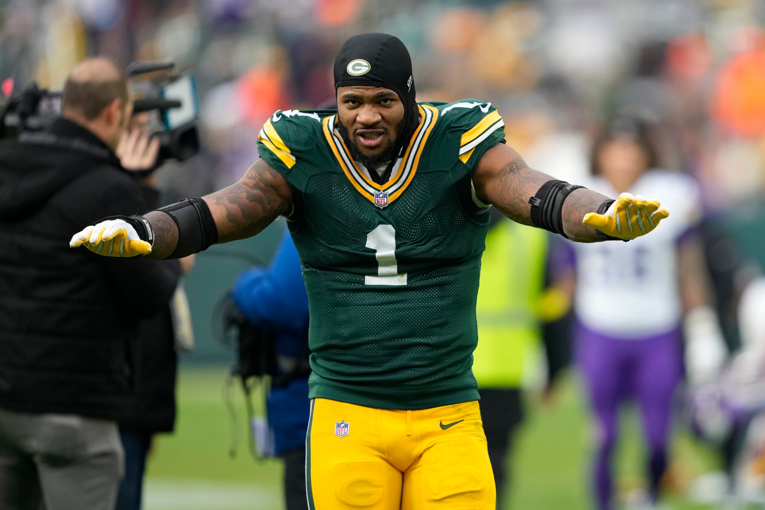 Nov 23, 2025; Green Bay, Wisconsin, USA; Green Bay Packers defensive end Micah Parsons (1) celebrates the victory over the Minnesota Vikings at Lambeau Field.
