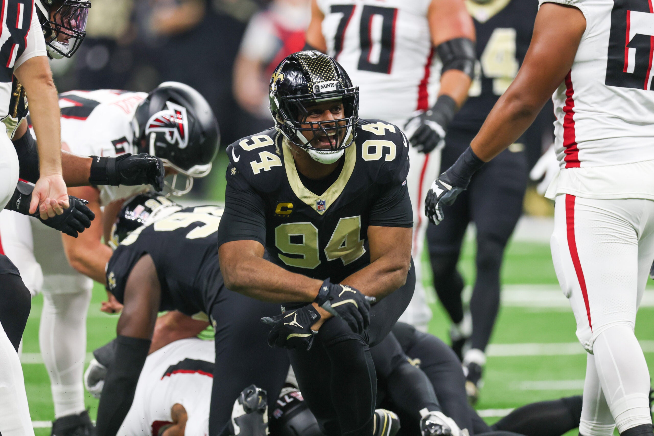 Nov 23, 2025; New Orleans, Louisiana, USA; New Orleans Saints defensive end Cameron Jordan (94) reacts after forcing a fumble against the Atlanta Falcons during the first half at Caesars Superdome.