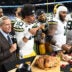 Nov 27, 2025; Detroit, Michigan, USA; Green Bay Packers quarterback Jordan Love (10), Green Bay Packers defensive end Micah Parsons (1) and Green Bay Packers defensive tackle Warren Brinson (91) eat turkey after defeating the Detroit Lions at Ford Field.