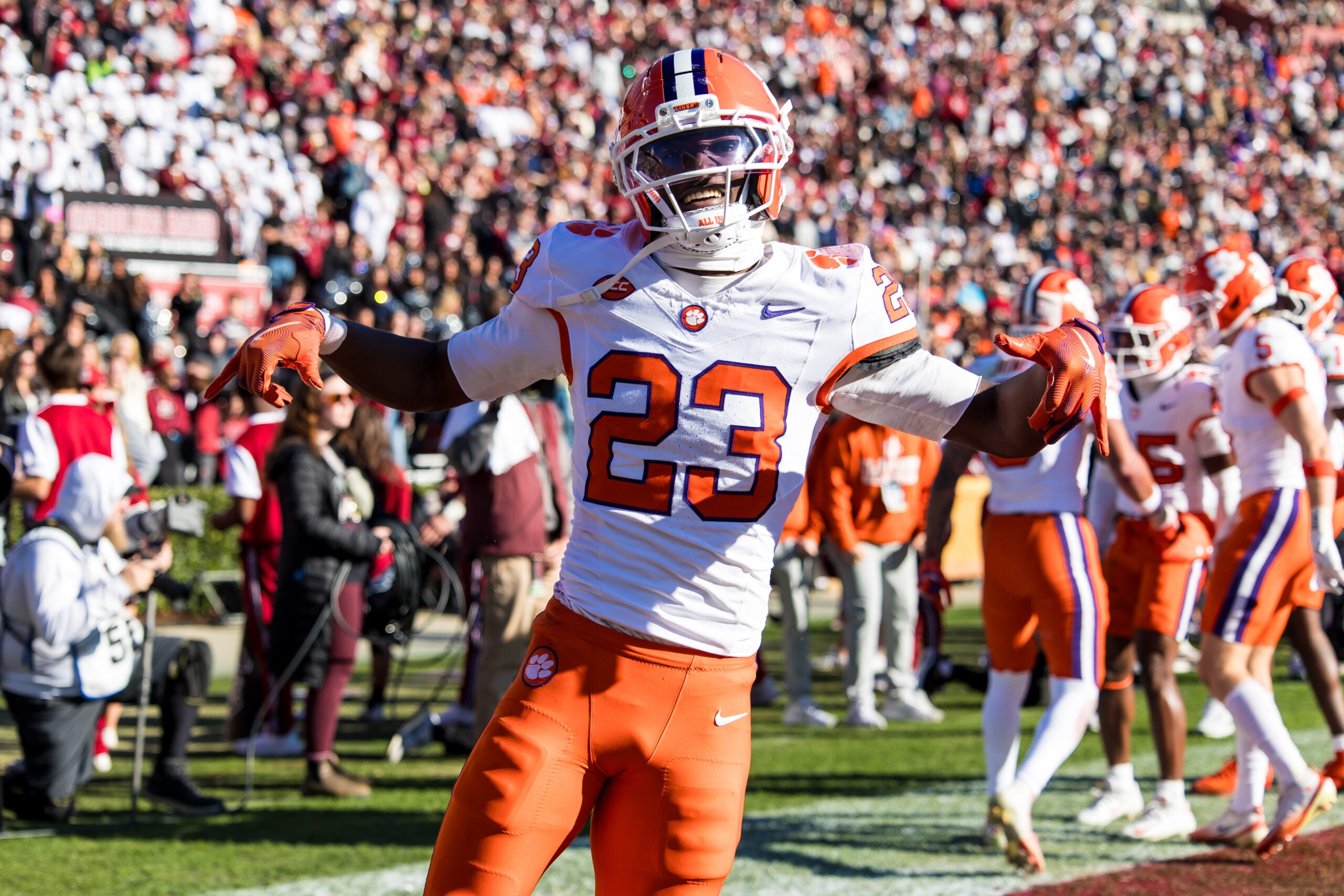 Nov 29, 2025; Columbia, South Carolina, USA; Clemson Tigers cornerback Ashton Hampton (23) celebrates an interception against the South Carolina Gamecocks in the second quarter at Williams-Brice Stadium.