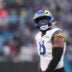 Nov 30, 2025; Charlotte, North Carolina, USA; Los Angeles Rams linebacker Jared Verse (8) looks on during the third quarter against the Carolina Panthers at Bank of America Stadium.