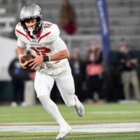 Thompson's quarterback Trent Seaborn (12) carries the ball against Opelika during their AHSAA 7A Football State Championship game in Birmingham, Ala. on Wednesday December 3, 2025.