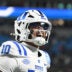 Dec 6, 2025; Charlotte, NC, USA; Duke Blue Devils quarterback Darian Mensah (10) celebrates after the Blue Devils score a touchdown in overtime during the ACC Championship game at Bank of America Stadium.