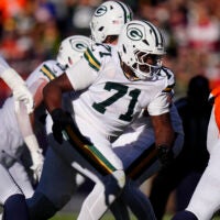 Dec 14, 2025; Denver, Colorado, USA; Green Bay Packers offensive tackle Anthony Belton (71) runs downfield during the first quarter against the Denver Broncos at Empower Field at Mile High.
