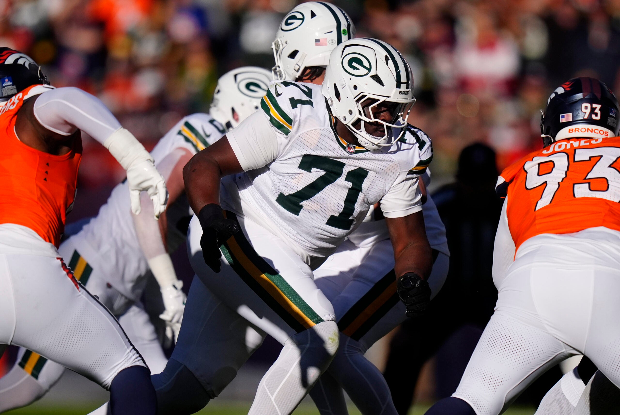 Dec 14, 2025; Denver, Colorado, USA; Green Bay Packers offensive tackle Anthony Belton (71) runs downfield during the first quarter against the Denver Broncos at Empower Field at Mile High.