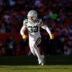 Dec 14, 2025; Denver, Colorado, USA; Green Bay Packers safety Evan Williams (33) runs downfield during the second quarter against the Denver Broncos at Empower Field at Mile High.