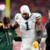 Dec 14, 2025; Denver, Colorado, USA; Green Bay Packers defensive end Micah Parsons (1) walks off the field with help from medical personnel following an injury during the third quarter against the Denver Broncos at Empower Field at Mile High.