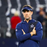 Dec 21, 2025; Arlington, Texas, USA; Dallas Cowboys head coach Brian Schottenheimer watches pregame warmups against the Los Angeles Chargers at AT&T Stadium.