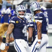 Dec 21, 2025; Arlington, Texas, USA; Dallas Cowboys quarterback Dak Prescott (4) celebrates with wide receiver George Pickens (3) following a touchdown pass caught by Pickens during the second quarter at AT&T Stadium.