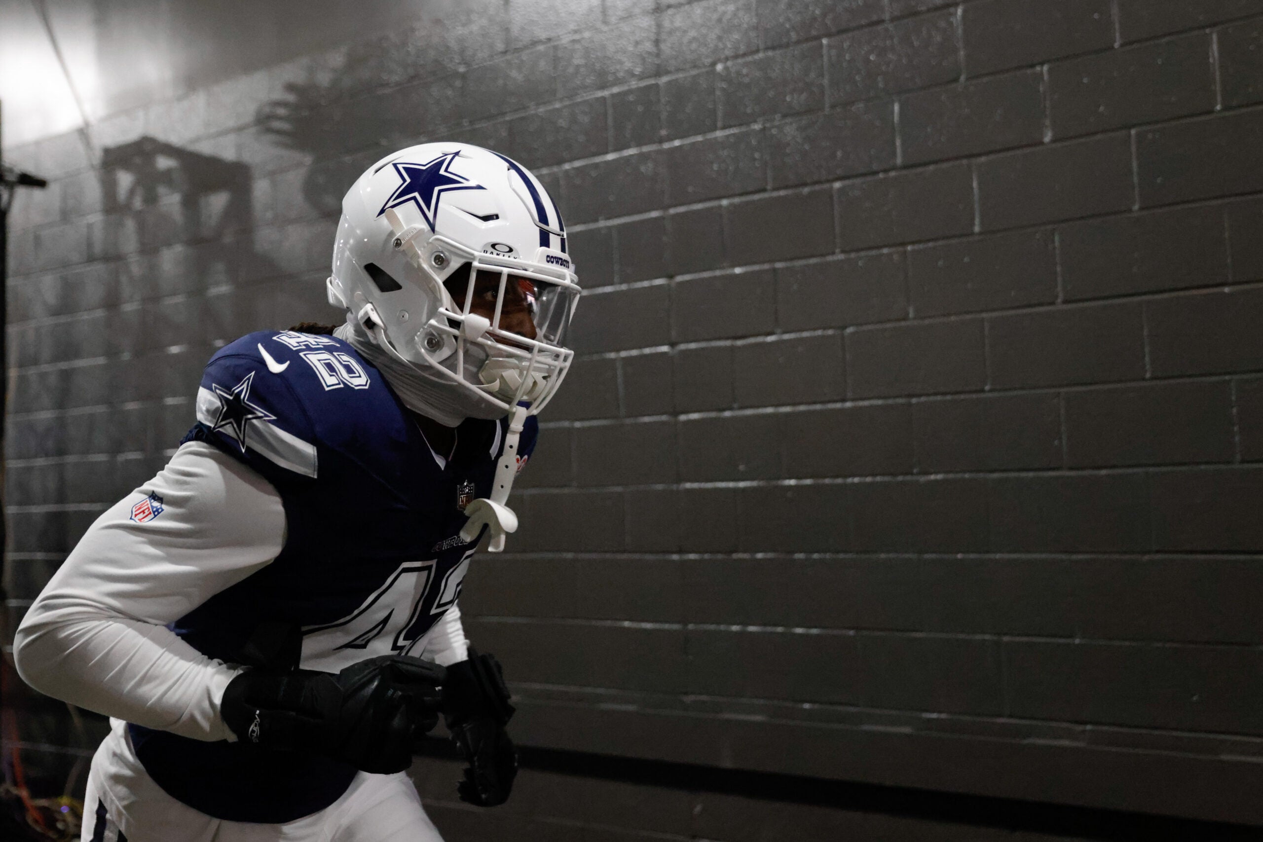 Dec 25, 2025; Landover, Maryland, USA; Dallas Cowboys defensive end Jadeveon Clowney (42) runs onto the field prior to the game against the Washington Commanders at Northwest Stadium.