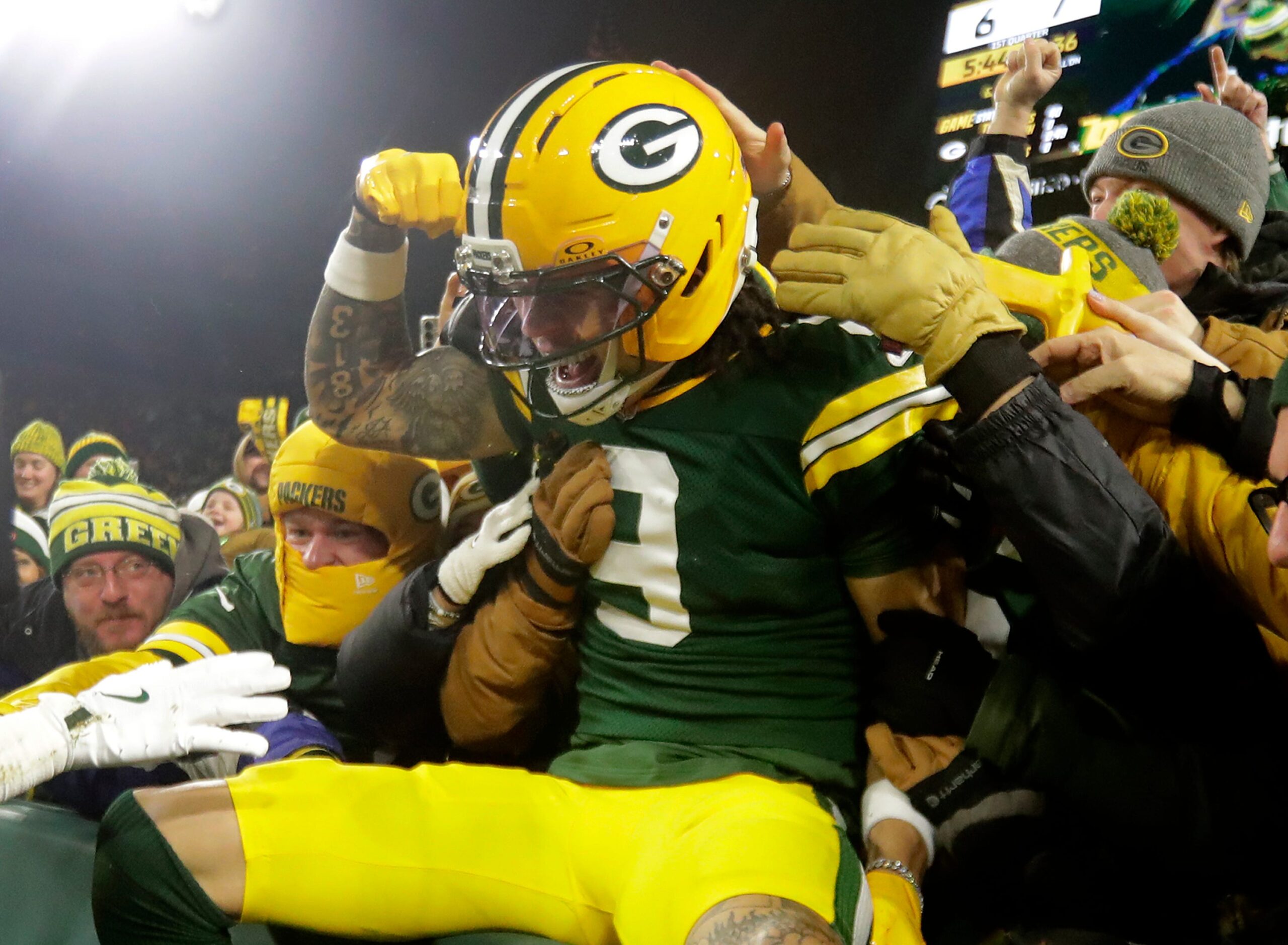 Green Bay Packers wide receiver Christian Watson (9) ceblebrates a touchdown against the Baltimore Ravens on Saturday, December 27, 2025, at Lambeau Field in Green Bay, Wis. The Ravens defeated the Packers 41-24.