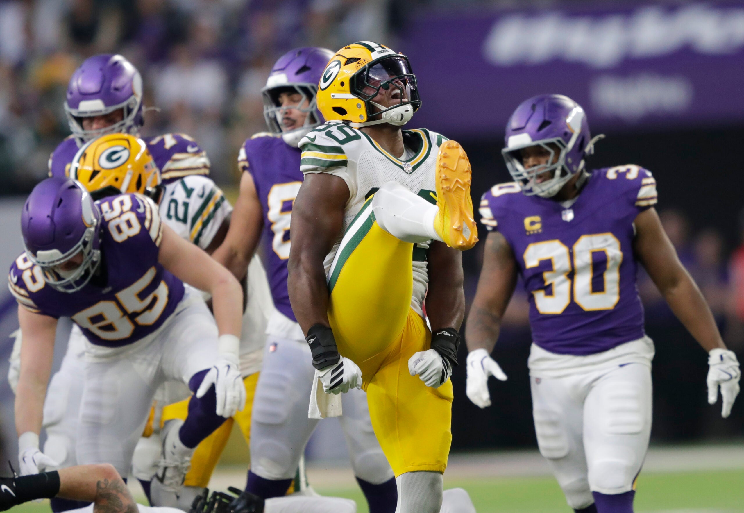 Jan 4, 2026; Minneapolis, Minnesota, USA; Green Bay Packers defensive end Barryn Sorrell (99) celebrates after tackling Minnesota Vikings running back Ty Chandler (32) for a loss during the game at U.S. Bank Stadium.