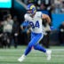 Jan 10, 2026; Charlotte, NC, USA; Los Angeles Rams tight end Colby Parkinson (84) makes a catch against the Carolina Panthers in the first half during the NFC Wild Card Round game at Bank of America Stadium.