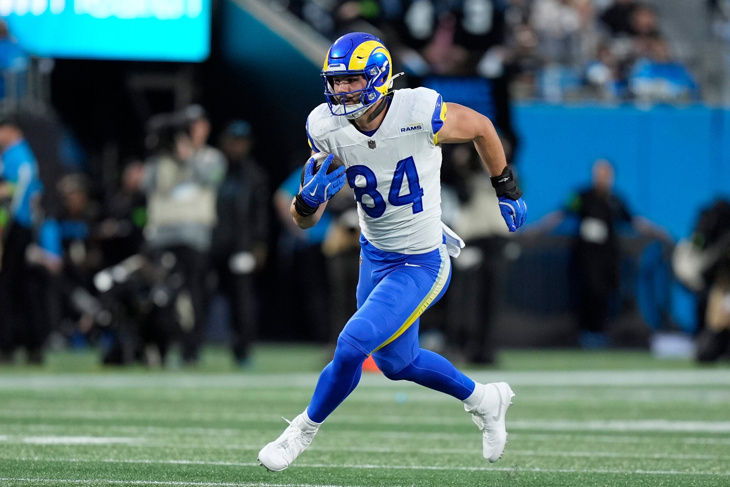 Jan 10, 2026; Charlotte, NC, USA; Los Angeles Rams tight end Colby Parkinson (84) makes a catch against the Carolina Panthers in the first half during the NFC Wild Card Round game at Bank of America Stadium.