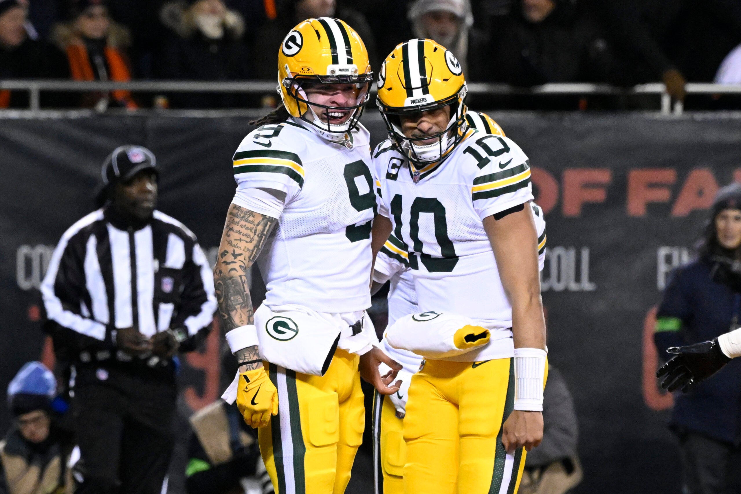 Jan 10, 2026; Chicago, IL, USA; Green Bay Packers wide receiver Christian Watson (9) and quarterback Jordan Love (10) react after hooking up on a touchdown pass and catch against the Chicago Bears during the first half of an NFC Wild Card Round game at Soldier Field.