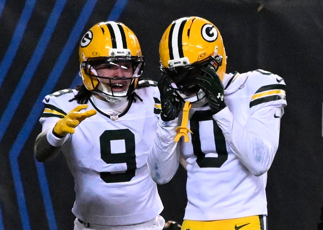 Jan 10, 2026; Chicago, IL, USA; Green Bay Packers wide receiver Matthew Golden (0) reacts with wide receiver Christian Watson (9) after scoring a touchdown against the Chicago Bears during the second half of an NFC Wild Card Round game at Soldier Field.