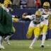 Green Bay Packers cornerback Carrington Valentine (24) celebrates his interception during the second quarter of their wild card playoff game against the Chicago Bears Saturday, January 10, 2026 at Soldier Field in Chicago, Illinois.