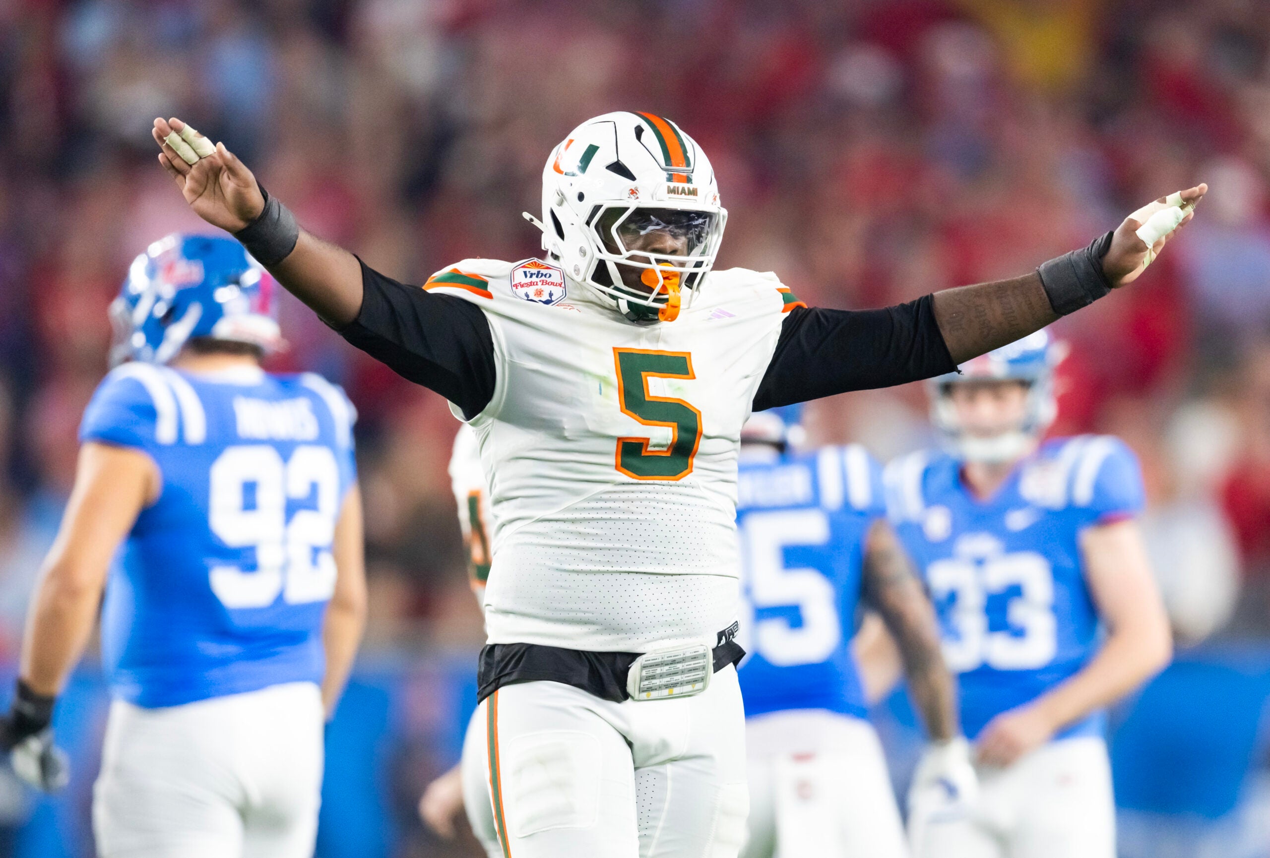 Jan 8, 2026; Glendale, AZ, USA; Miami Hurricanes defensive lineman Justin Scott (5) against the Mississippi Rebels during the 2026 Fiesta Bowl and semifinal game of the College Football Playoff at State Farm Stadium.