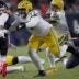 Green Bay Packers guard Jordan Morgan (77) clears the way for running back Josh Jacobs (8) during the second quarter of their wild card playoff game against the Chicago Bears Saturday, January 10, 2026 at Soldier Field in Chicago, Illinois.