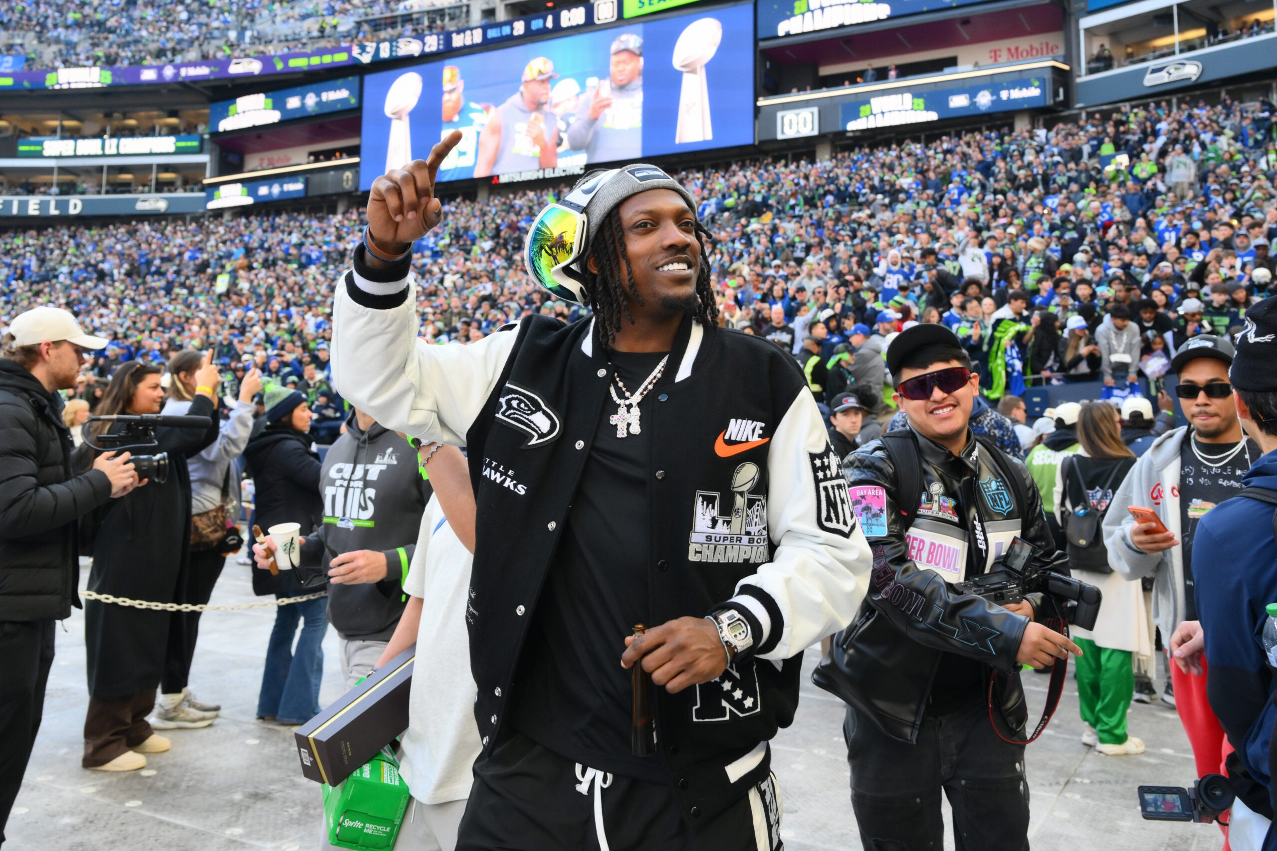 Feb 11, 2026; Seattle, WA, USA; Seattle Seahawks cornerback Riq Woolen (27) before the Super Bowl LX trophy presentation at Lumen Field.