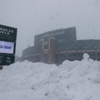 Snow falls around Lambeau Field on Sunday, March 15, 2026, in Green Bay, Wis. The storm is forecasted to drop approximately 16 inches of snow by the time it clears in the afternoon of March 16.