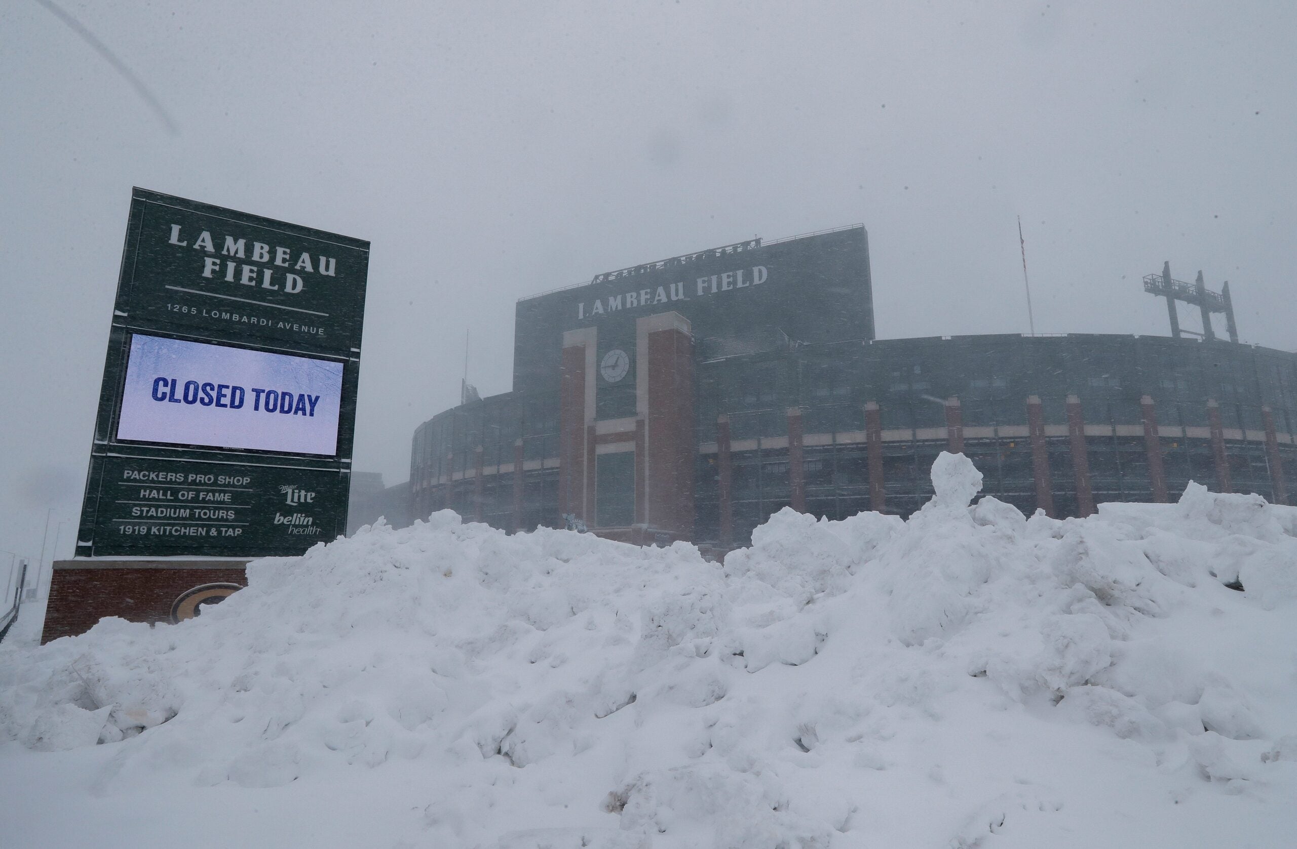 Snow falls around Lambeau Field on Sunday, March 15, 2026, in Green Bay, Wis. The storm is forecasted to drop approximately 16 inches of snow by the time it clears in the afternoon of March 16.