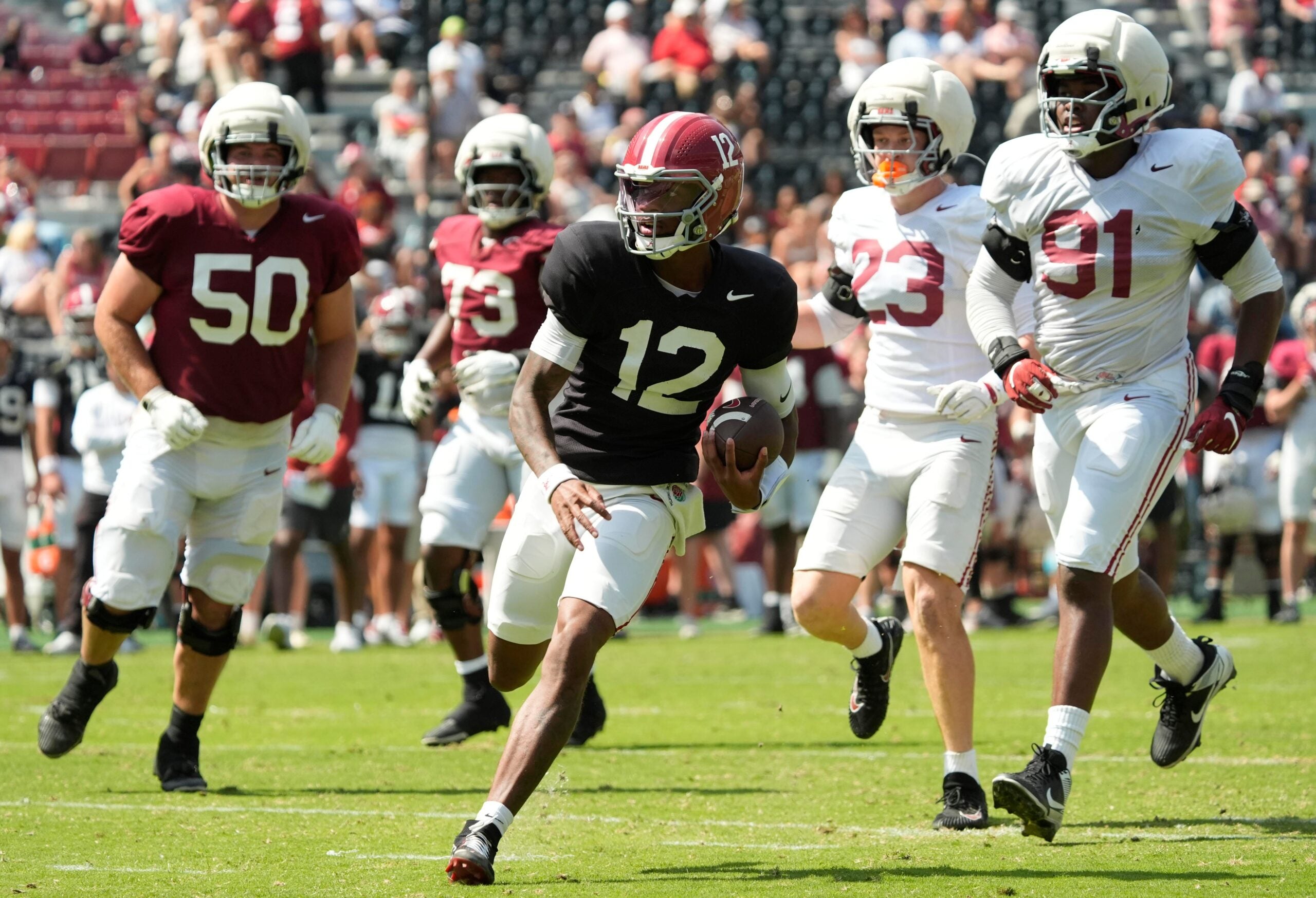 April 11, 2026; Tuscaloosa, AL, USA; Alabama quarterback Keelon Russell runs the ball at Bryant-Denny Stadium during the Alabama A Day scrimmage.