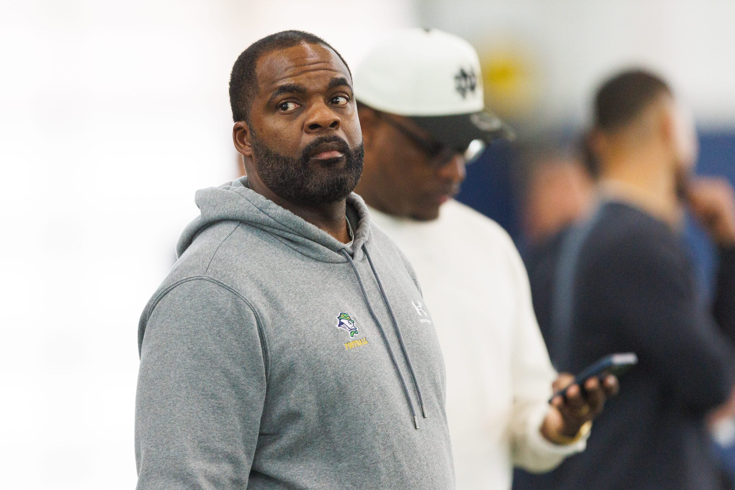 Linebackers coach Brian Jean-Mary (foreground) and defensive backs coach Aaron Henry during Notre Dame football's Pro Day at Irish Athletics Center on Tuesday, March 24, 2026, in South Bend.