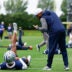 May 1, 2026; Frisco, TX, USA; Dallas Cowboys cornerback Caleb Downs (18) speaks with defensive coordinator Christian Parker during practice at the Ford Center at the Star Training Facility in Frisco, Texas.