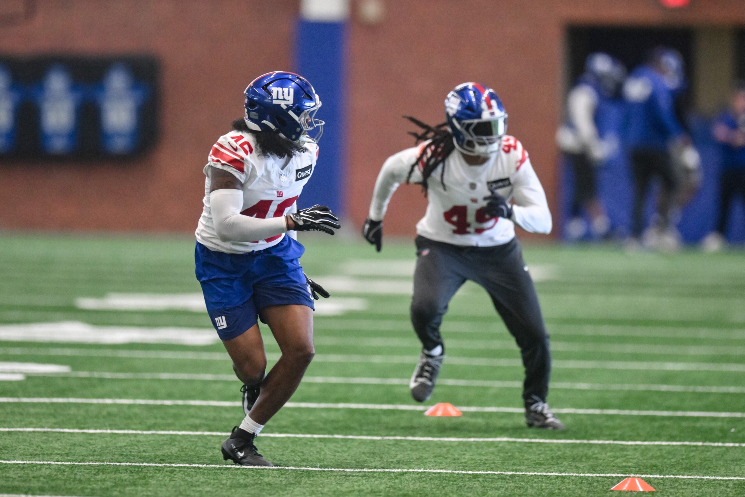 May 21, 2026; East Rutherford, NJ, USA; New York Giants linebacker Zaire Barnes (46) and linebacker Tremaine Edmunds (49) participate in a drill during organized team activities at Quest Diagnostics Training Center.