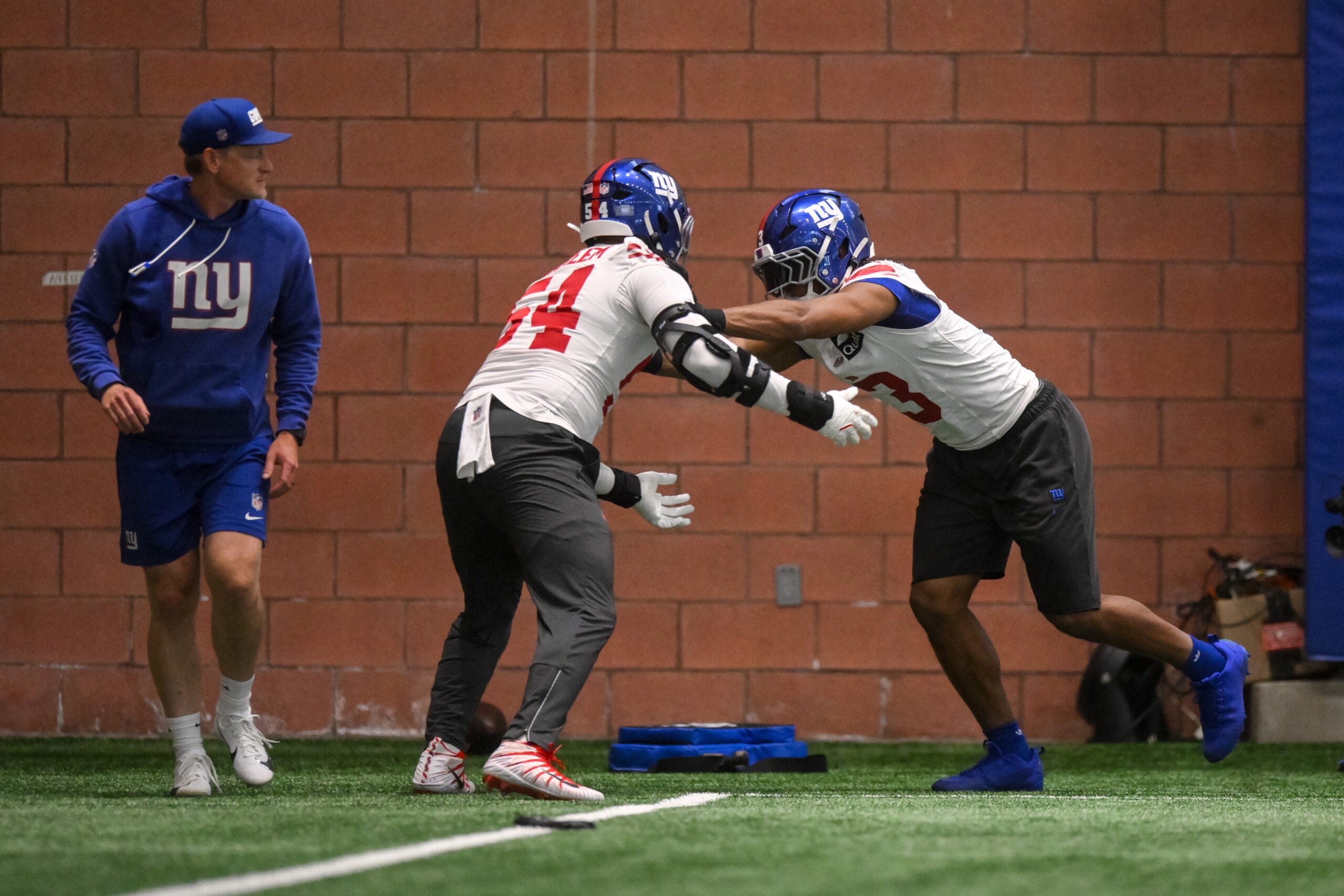 May 21, 2026; East Rutherford, NJ, USA; New York Giants outside linebacker Abdul Carter (3) and linebacker Khalid Kareem (54) participate in a drill during organized team activities at Quest Diagnostics Training Center.
