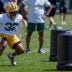 Green Bay Packers running back MarShawn Lloyd (32) runs through a drill during practice on Tuesday, June 2, 2026, at Ray Nitschke Field in Ashwaubenon, Wis.