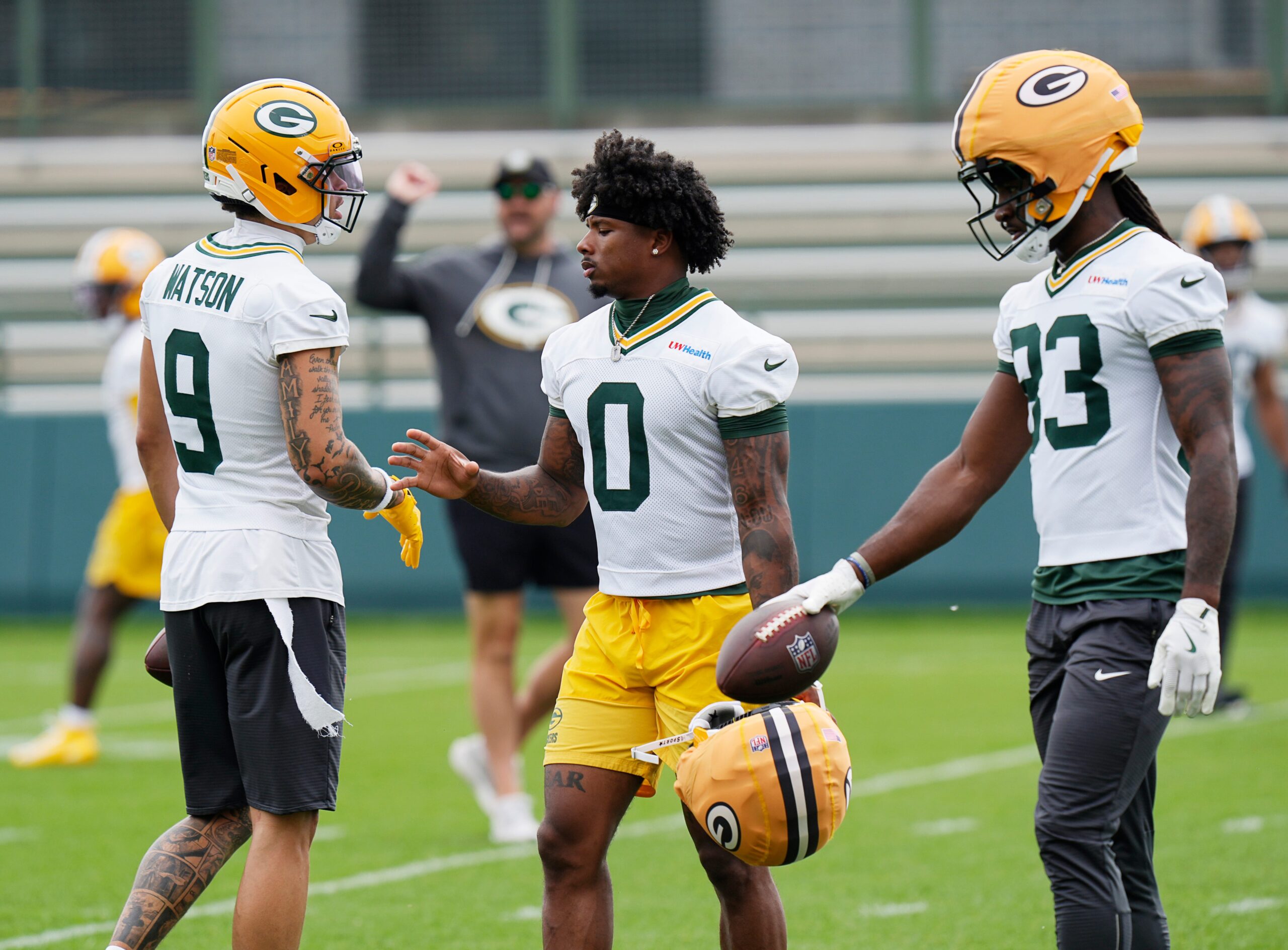 Green Bay Packers wide receiver Christian Watson (9), Green Bay Packers wide receiver Matthew Golden (0), and Green Bay Packers wide receiver Savion Williams (83) prepare to run drills during the first day of a three-day minicamp at the Don Hutson Center in Ashwaubenon, Wisconsin on Tuesday, June 9, 2026.