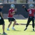 Jun 9, 2026; Henderson, NV, USA; Las Vegas Raiders quarterbacks Fernando Mendoza (15) and Kirk Cousins (8) throw the ball as assistant head coach Mike McCoy (left) watches during minicamp at Intermountain Health Performance Center.