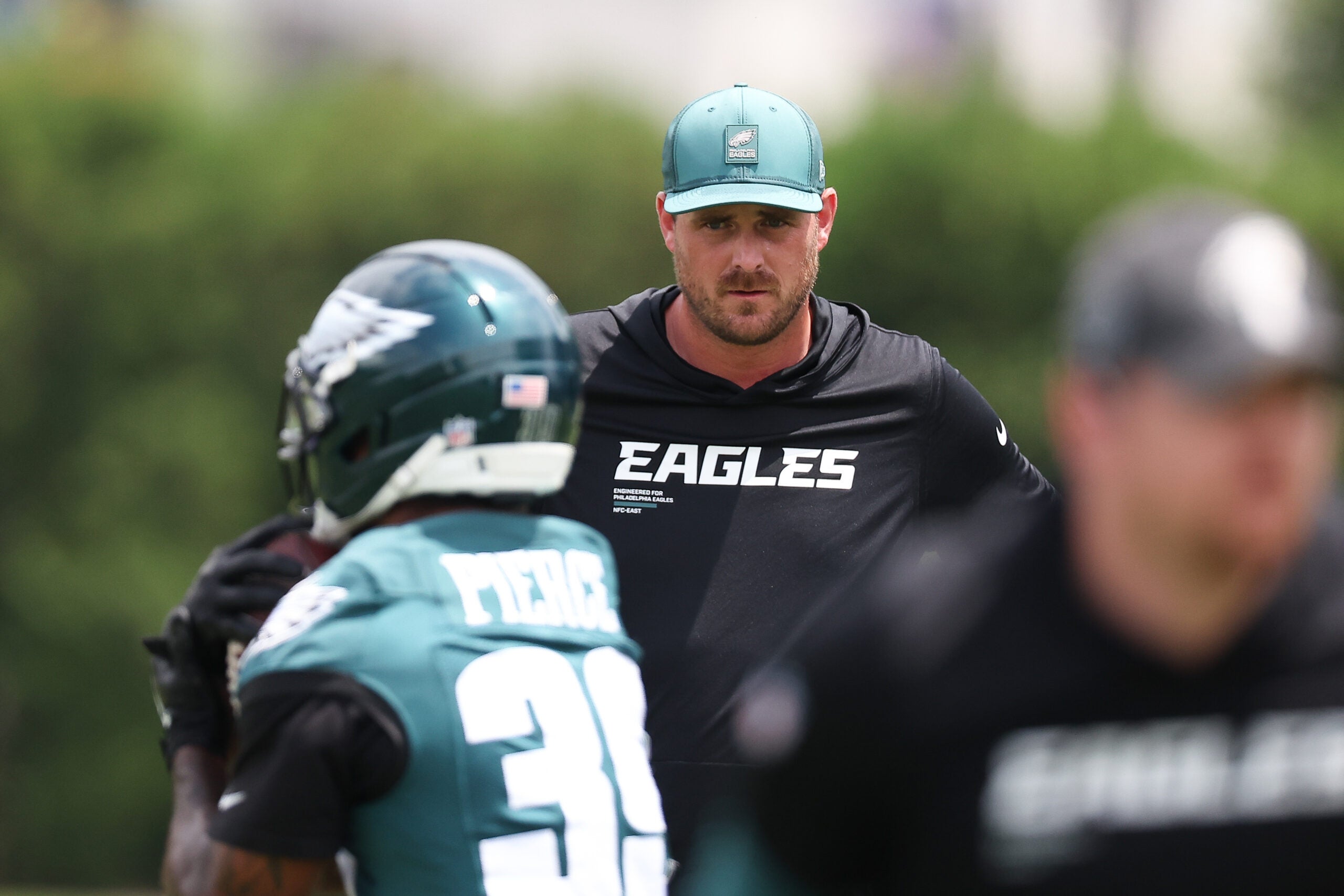 Jun 10, 2026; Philadelphia, PA, USA; Philadelphia Eagles offensive coordinator Sean Mannion watches as players run drills during minicamp at Jefferson Health Training Complex.