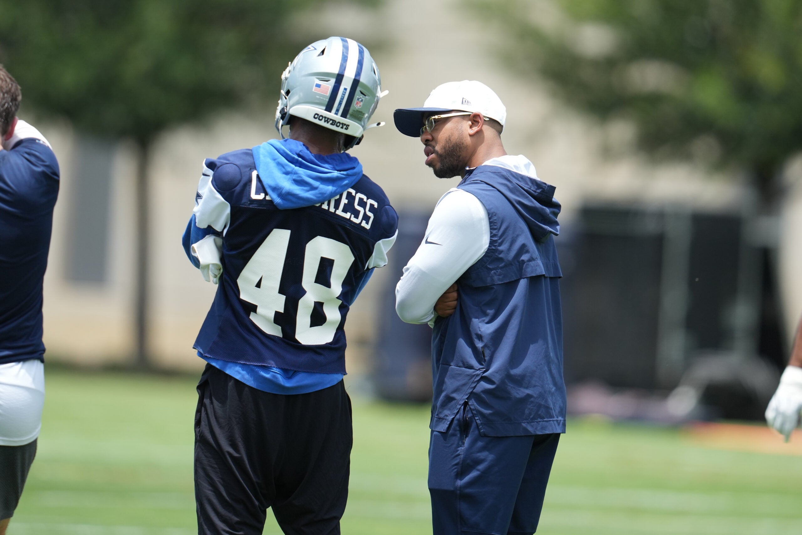 Jun 16, 2026; Dallas, TX, USA; Dallas Cowboys defensive coordinator Christian Parker speaks with cornerback Zion Childress (48) during practice at the Ford Center at the Star Training Facility in Frisco, Texas.