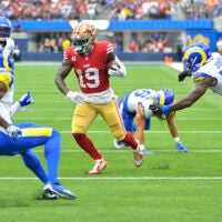 Sep 17, 2023; Inglewood, California, USA; San Francisco 49ers wide receiver Deebo Samuel (19) runs through the Los Angeles Rams defense for a touchdown in the second half at SoFi Stadium.