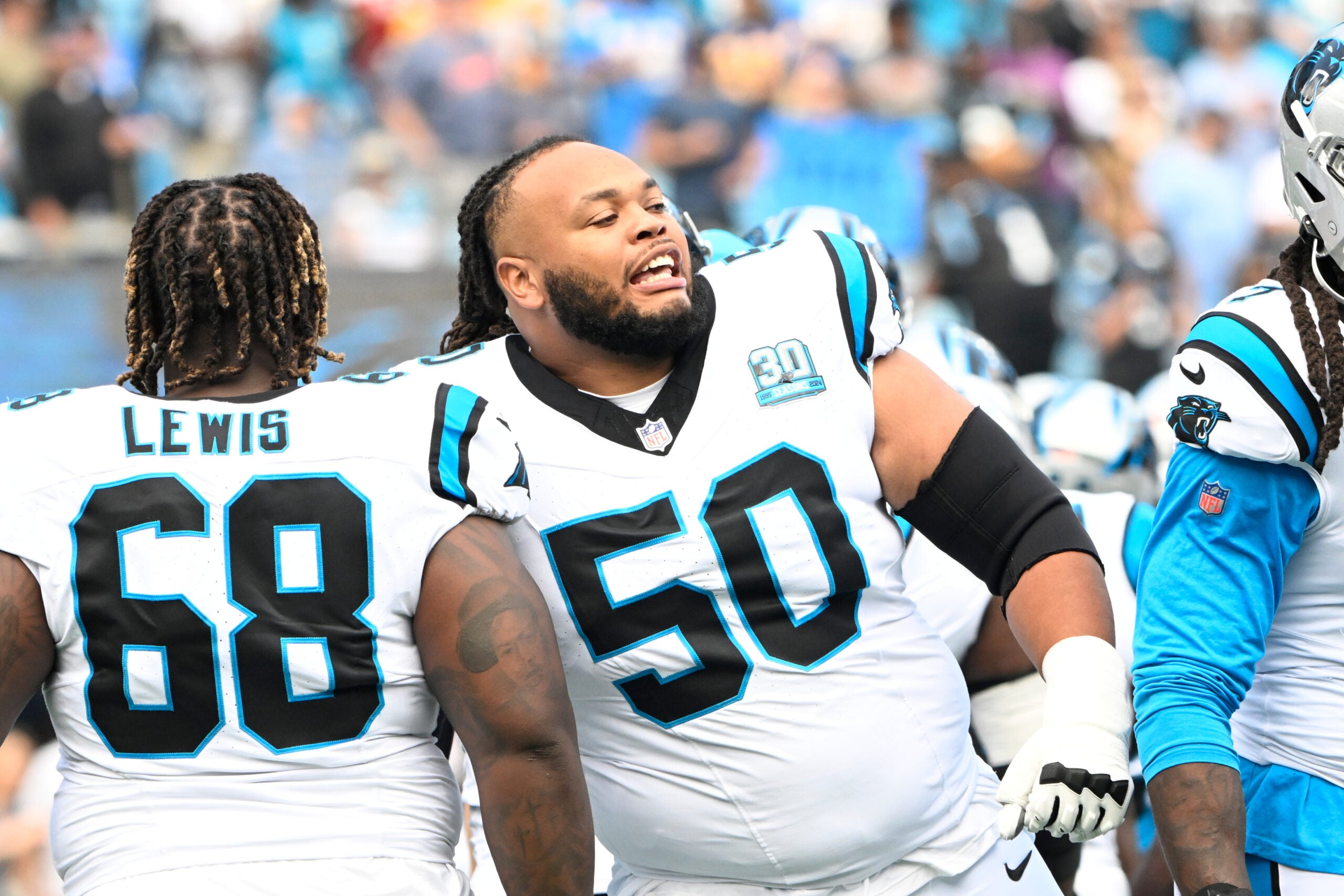 Sep 15, 2024; Charlotte, North Carolina, USA; Carolina Panthers guard Damien Lewis (68) and guard Robert Hunt (50) before the game at Bank of America Stadium.