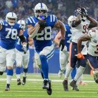 Sep 22, 2024; Indianapolis, Indiana, USA; Indianapolis Colts running back Jonathan Taylor (28) rushes for a touchdown during a game against the Chicago Bears at Lucas Oil Stadium.