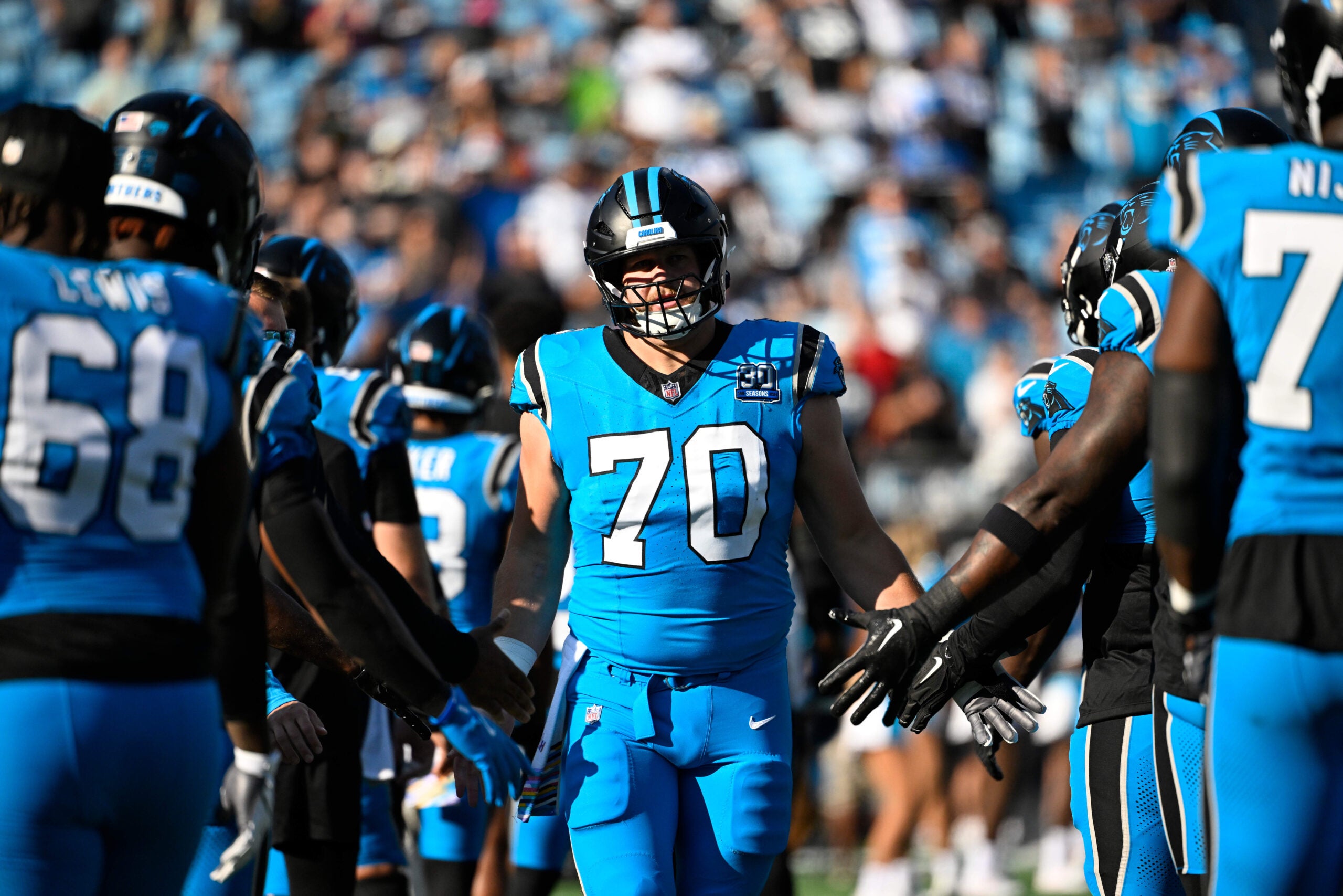 Oct 13, 2024; Charlotte, North Carolina, USA; Carolina Panthers guard Brady Christensen (70) is introduced before the game at Bank of America Stadium.