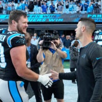 Nov 3, 2024; Charlotte, North Carolina, USA; Carolina Panthers guard Brady Christensen (70) with head coach Dave Canales after the game at Bank of America Stadium.