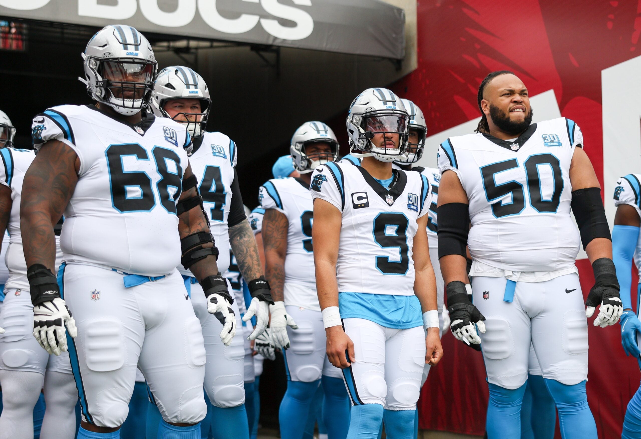 Dec 29, 2024; Tampa, Florida, USA; Carolina Panthers guard Damien Lewis (68) quarterback Bryce Young (9), and guard Robert Hunt (50) looks on before a game against the Tampa Bay Buccaneers at Raymond James Stadium.