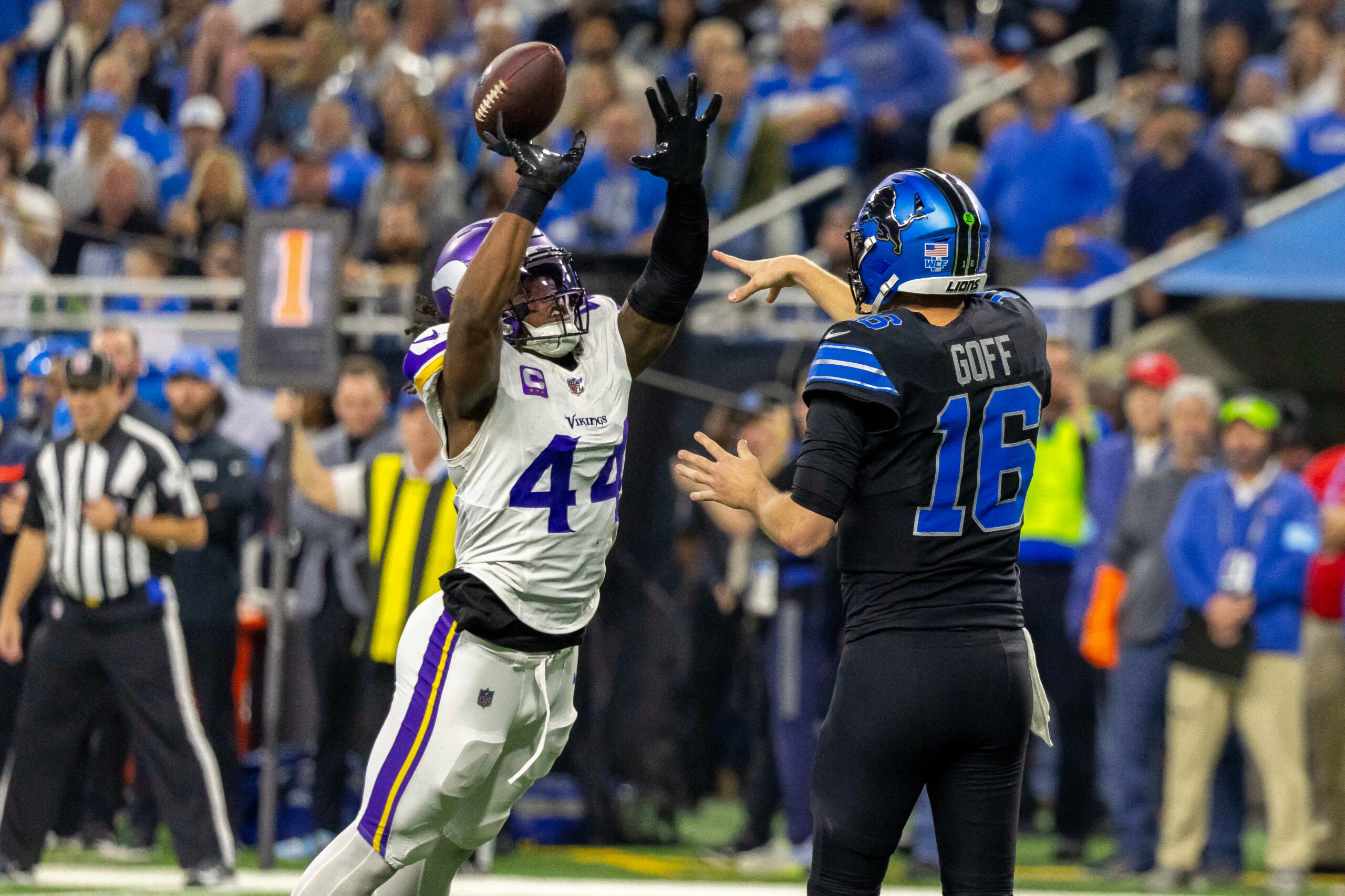 Jan 5, 2025; Detroit, Michigan, USA; Minnesota Vikings safety Josh Metellus (44) tips a pass by Detroit Lions quarterback Jared Goff (16) which was intercepted by Minnesota Vikings linebacker Ivan Pace Jr. (0) during the first half at Ford Field.