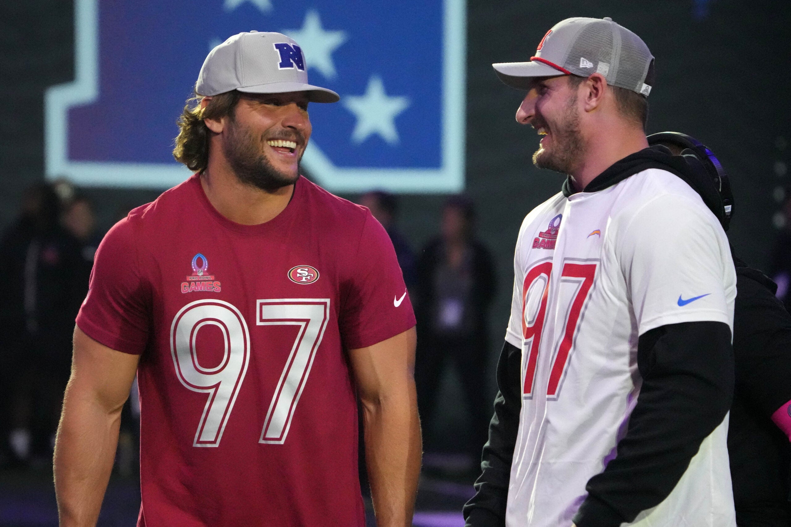 Jan 30, 2025; Orlando, FL, USA; NFC defensive end Nick Bosa of the San Francisco 49ers (left) with brother and AFC linebacker Joey Bosa during the Pro Bowl Skills Challenge at Nicholson Fieldhouse.
