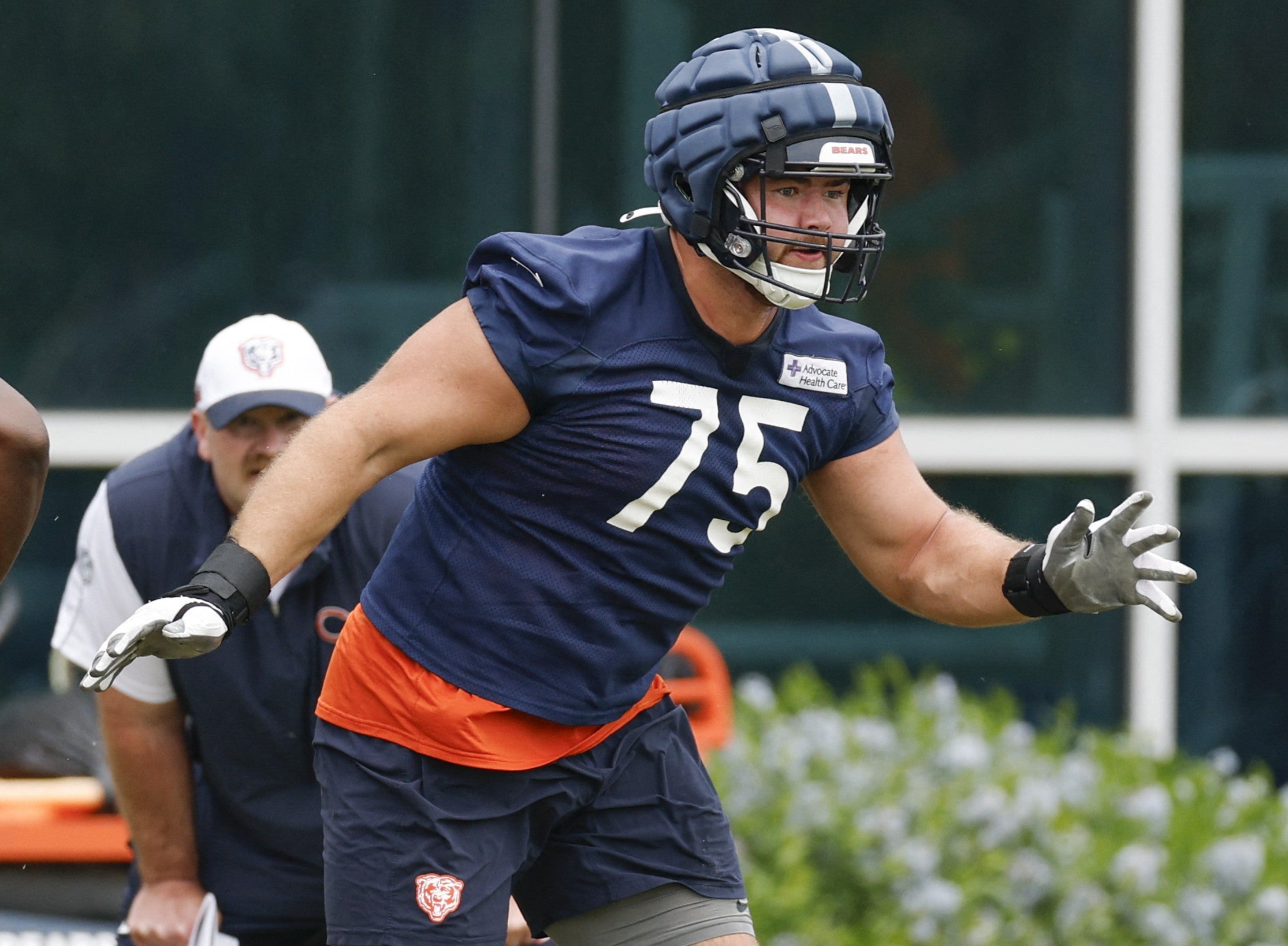 Jun 3, 2025; Lake Forest, IL, USA; Chicago Bears offensive tackle Ozzy Trapilo (75) runs on the field during minicamp at Halas Hall.