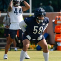 Jul 23, 2025; Lake Forest, IL, USA; Chicago Bears offensive tackle Darnell Wright (58) stretches during training camp at Halas Hall.
